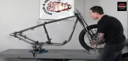 strapped frame on motorcycle table lift